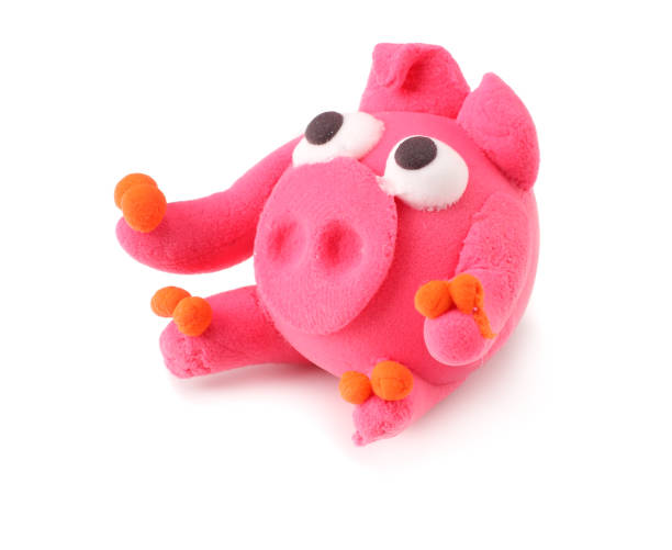 istock Kids modelling clay pig isolated on white background 1094825478