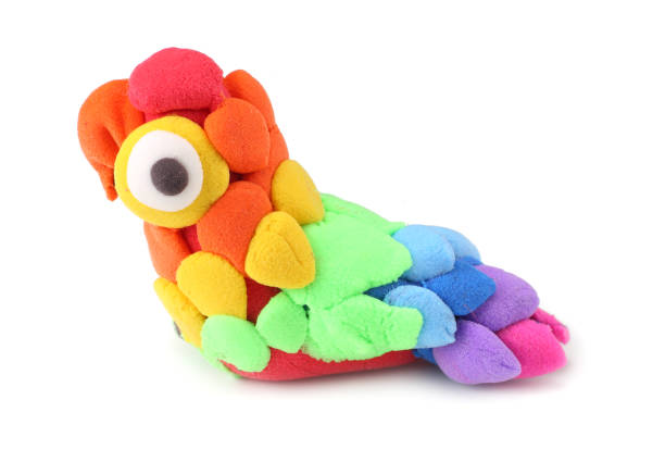 istock Kids modelling clay parrot isolated on white background 1094825480