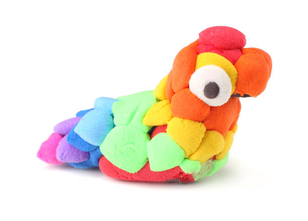 istock Kids modelling clay parrot isolated on white background 1094825518