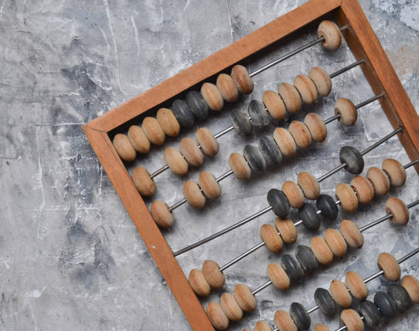 istock Wooden old abacus on a gray concrete floor. Top view. 1094826216