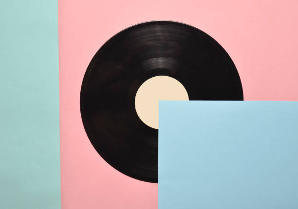 istock Vinyl plate on a colored pastel background. Retro musical attributes from the 80s. top view, minimalism. Copy space 1094826456