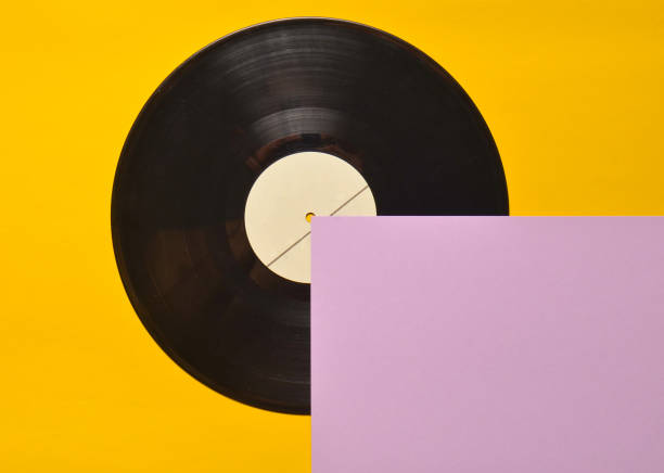 istock Vinyl plate on a colored pastel background. Retro musical attributes from the 80s. top view, minimalism. Copy space. 1094826470