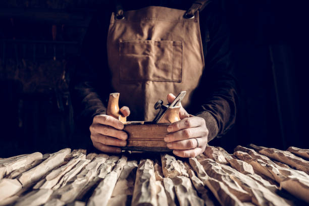 vintage tools background detail of hands holding vintage hand planer craftsperson stock pictures, royalty-free photos & images