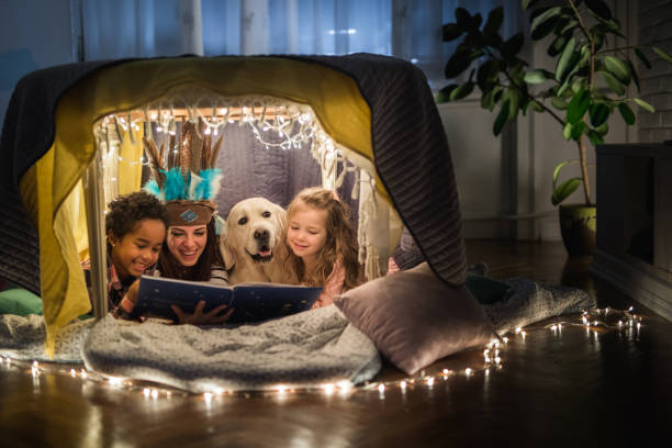 istock Book reading in a tent at home! 1094833346