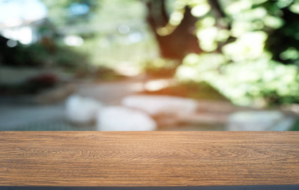 istock Empty dark wooden table in front of abstract blurred bokeh background of restaurant . can be used for display or montage your products.Mock up for space. 1094835202