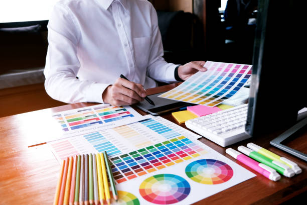 istock Graphic designer working on digital tablet. artist drawing on graphic tablet and Color swatch samples. 1094835246