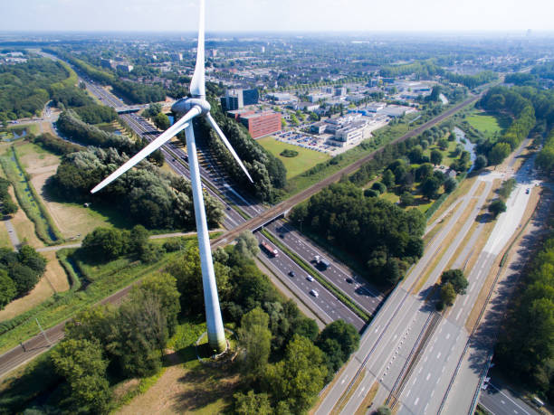 Windmill next to highway A windmill next to a highway in 's-Hertogenbosch, seen from above netherlands aerial stock pictures, royalty-free photos & images
