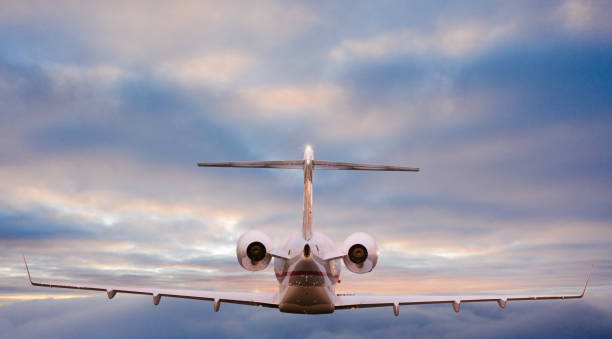 istock Small private jetplane flying above beautiful clouds. 1094841708