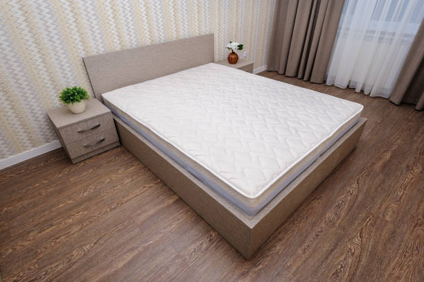 istock New empty brown bedroom with twin bed, bedside tables and curtain 1094843494