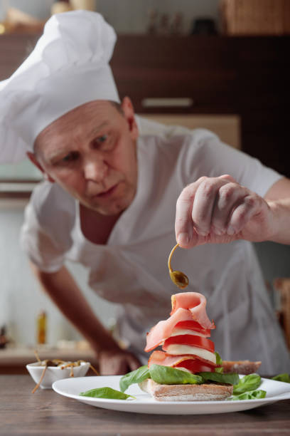 istock Chef prepares a snack with mozzarella and smoked meat . 1094847550