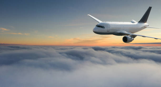 istock Commercial airplane jetliner flying above dramatic clouds. 1094849658