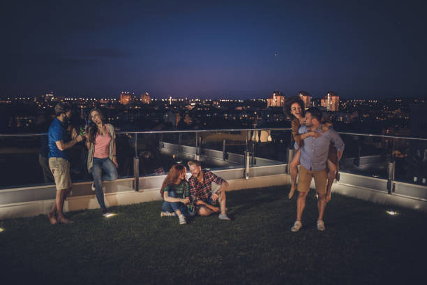 istock Happy couples spending a night on a penthouse terrace. 1094859868