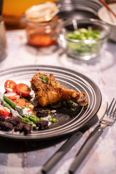 istock Roasted chicken leg and vegetable salad 1094861692