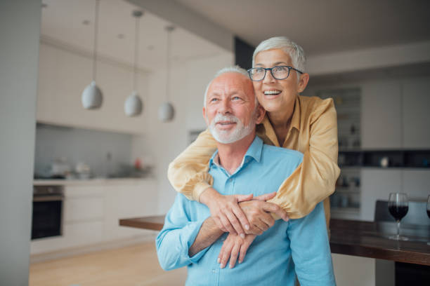 istock Senior woman hugging her husband 1094867346
