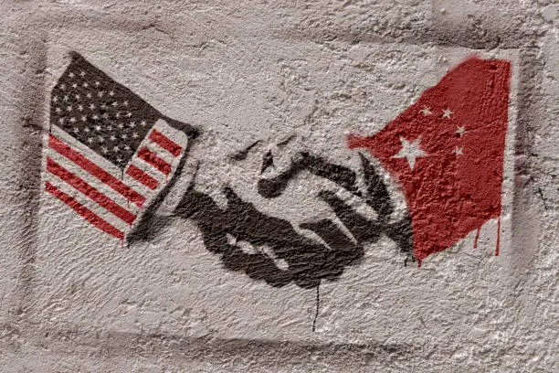 Stencil graffiti representing the agreement of two countries (USA - CHINA). Photographer's own design.