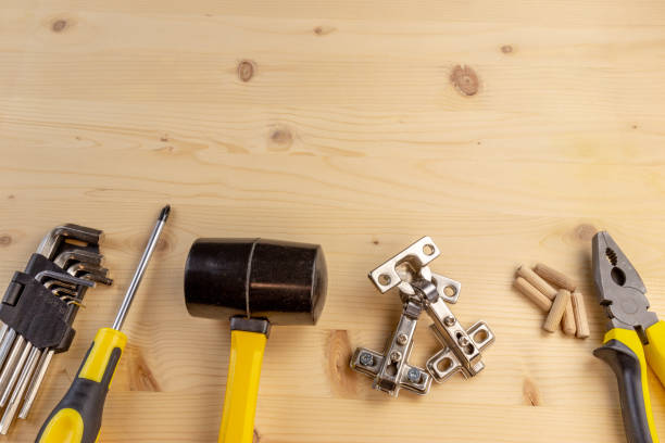 istock Furniture assembly components and tools arranged in a still life on a table. Background with copy space. 1094883484