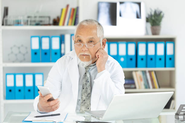 istock Mature asian doctor in his cabin 1094884206