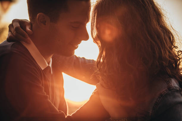 istock Couple hugging in sunset 1094885626