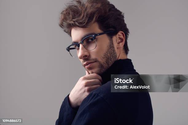 Handsome Elegant Man With Curly Hair Wearing Black Turtleneck And Glasses  Stock Photo - Download Image Now - iStock
