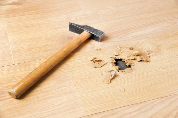 istock hole in the parquet floor 1094886752
