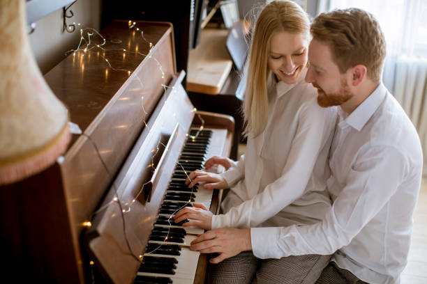 istock Loving young couple playing piano 1094890906