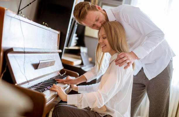 istock Loving young couple playing piano 1094890970
