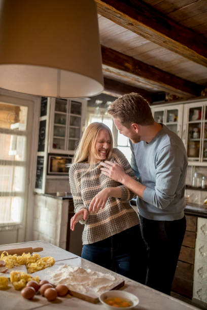 istock Loving couple preparing pasta in the kitchen 1094891066