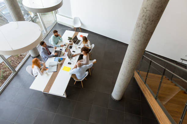 istock Top view at business people working in office 1094891396