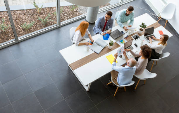 istock Top view at business people in office 1094891402
