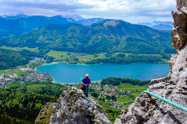 istock Climber looks back into the valley 1094891696