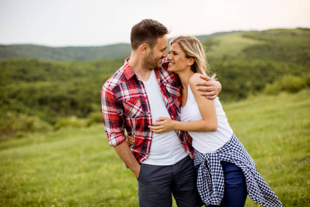 istock Loving embracing coulpe having fun in the spring nature 1094894090
