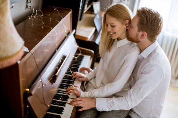 istock Loving young couple playing piano 1094895220