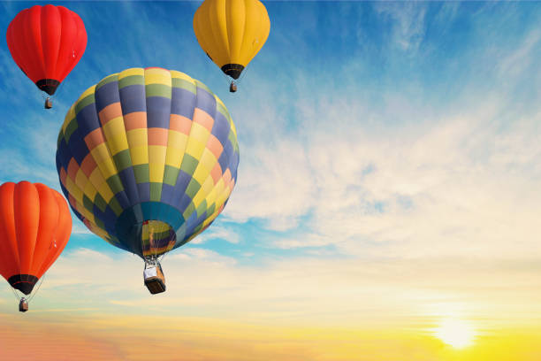 istock Colorful balloons floating in the sky at sunset. 1094909512