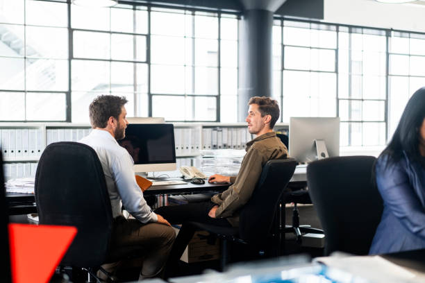 istock Confident male colleagues planning at new office 1094910424