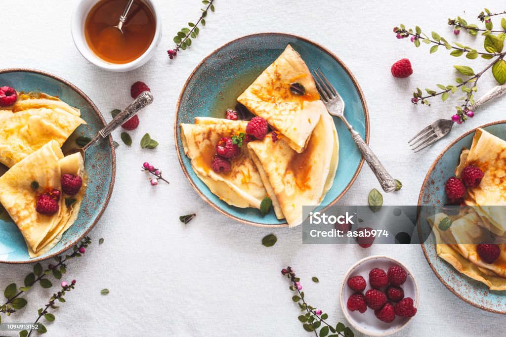 Pancake Suzette Citrus Sauce and Rum and Raspberries for Candlemas Crêpe Suzette Citrus Sauce and Rum and Raspberries for Candlemas Crêpe - Pancake Stock Photo