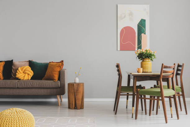 istock Vintage living and dining room with comfortable couch and retro chairs 1094914842