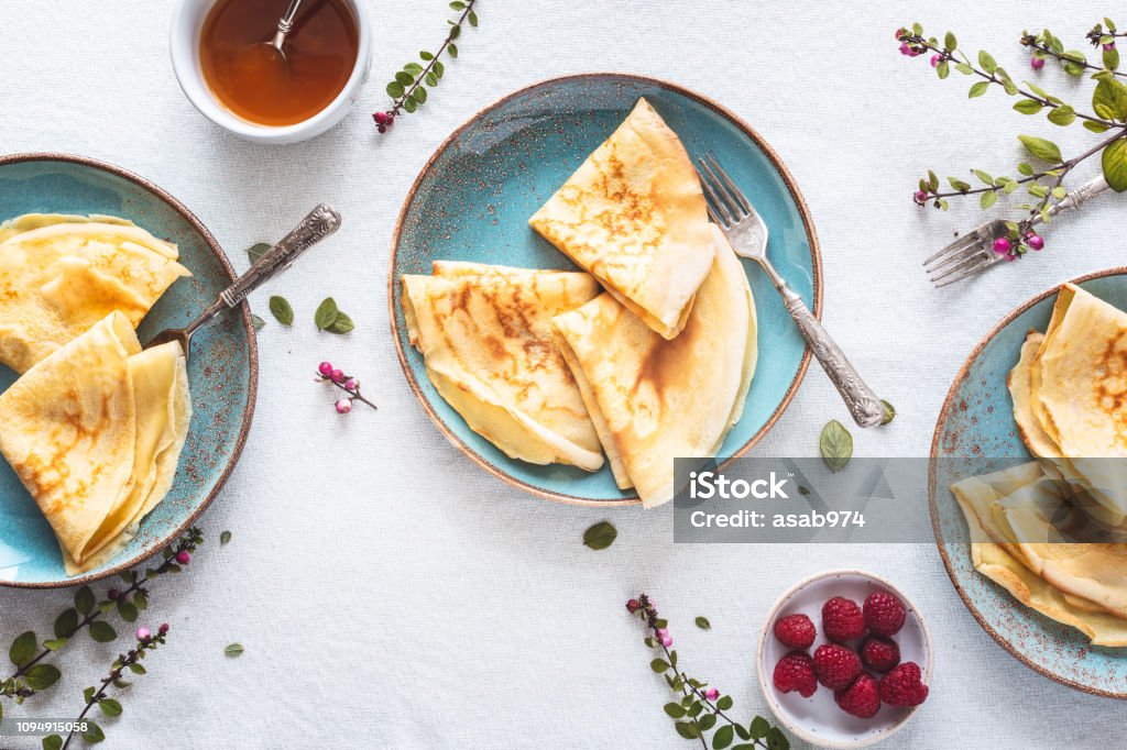 Pancake Suzette Citrus Sauce and Rum and Raspberries for Candlemas Crêpe Suzette Citrus Sauce and Rum and Raspberries for Candlemas Crêpe - Pancake Stock Photo