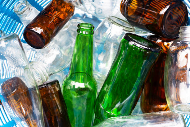 istock Glass bottles in waste basket. 1094915436