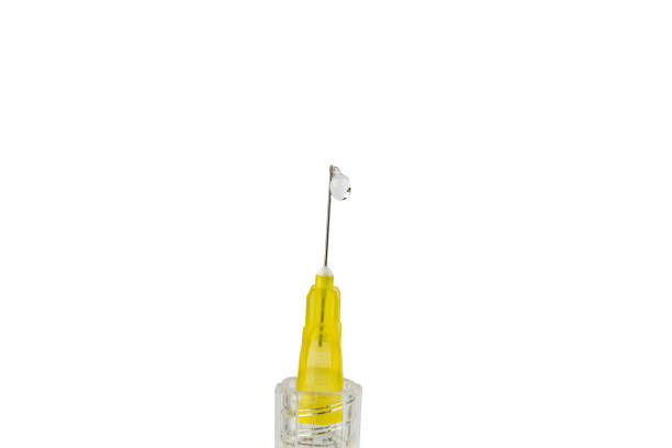 istock Disposable syringe with drop on needle isolated on white with clipping path 1094915772