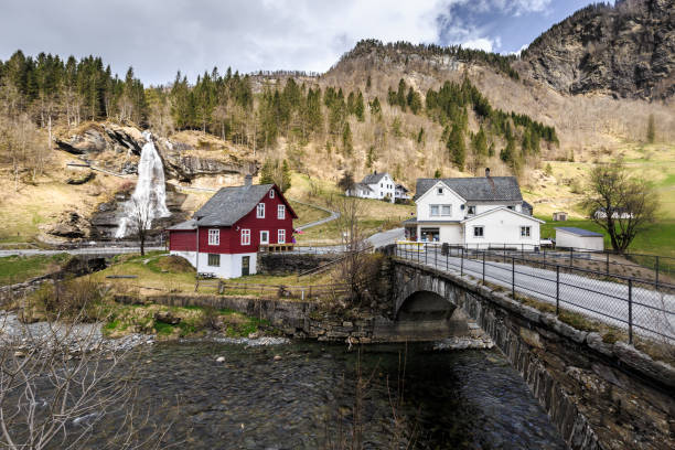 istock Steinsdalfossen waterfall with souvenir shop in Steine 1094918062