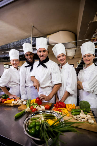 istock Group of chefs preparing food in kitchen 1094918256