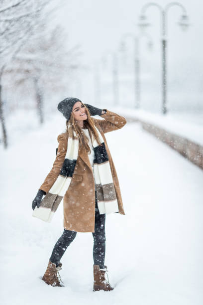 istock Stylish woman on the snow 1094918544