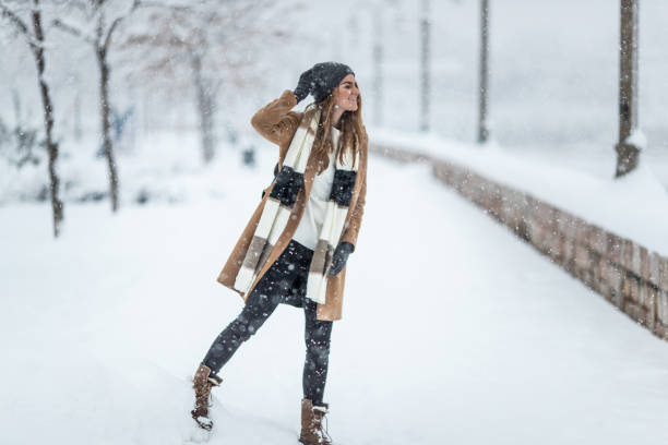 istock Stylish woman on the snow 1094918970