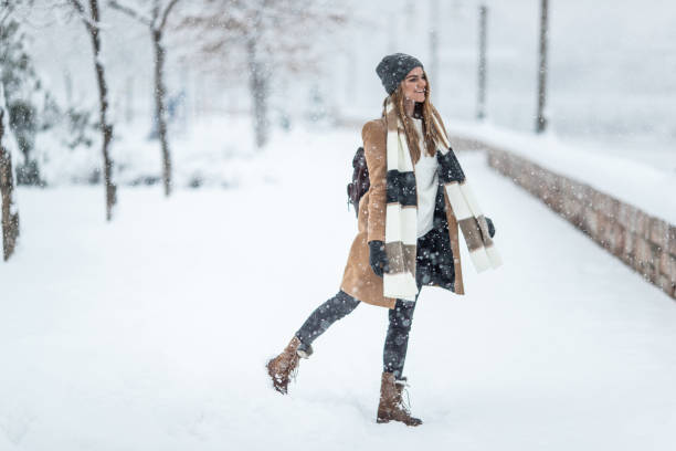 istock Stylish woman on the snow 1094919152