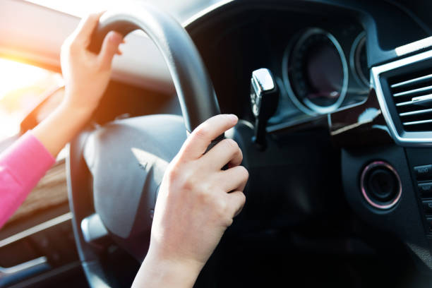 istock Woman hands holding steering wheel 1094919210