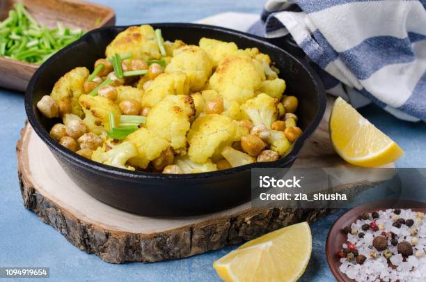 Slices Of Roasted Cauliflower Stock Photo - Download Image Now - Cauliflower, Chick-Pea, Curry - Meal