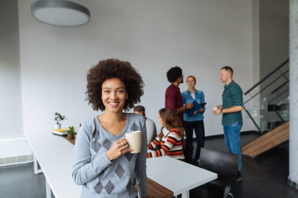 istock Woman having coffee break in the office 1094921192
