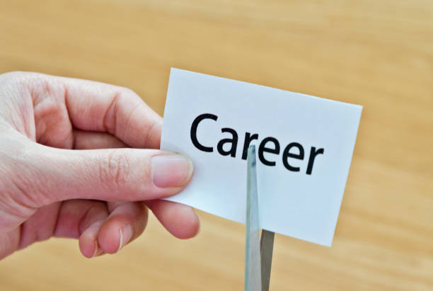 istock Human hand cutting the career word 1094922272