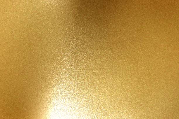 istock Abstract background, light shining on rough gold metal floor texture 1094922826