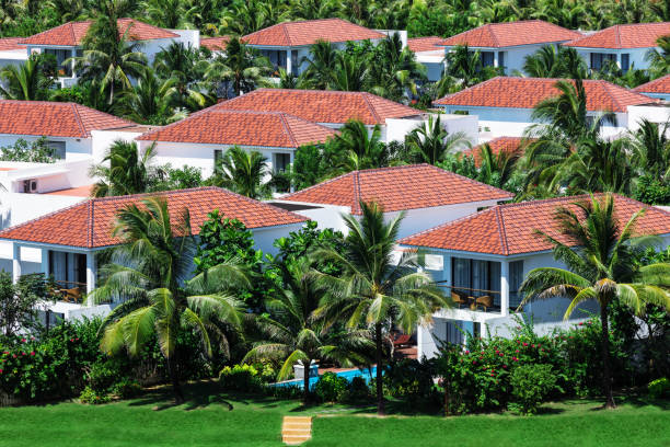 istock beautiful white villas and palm trees 1094924066
